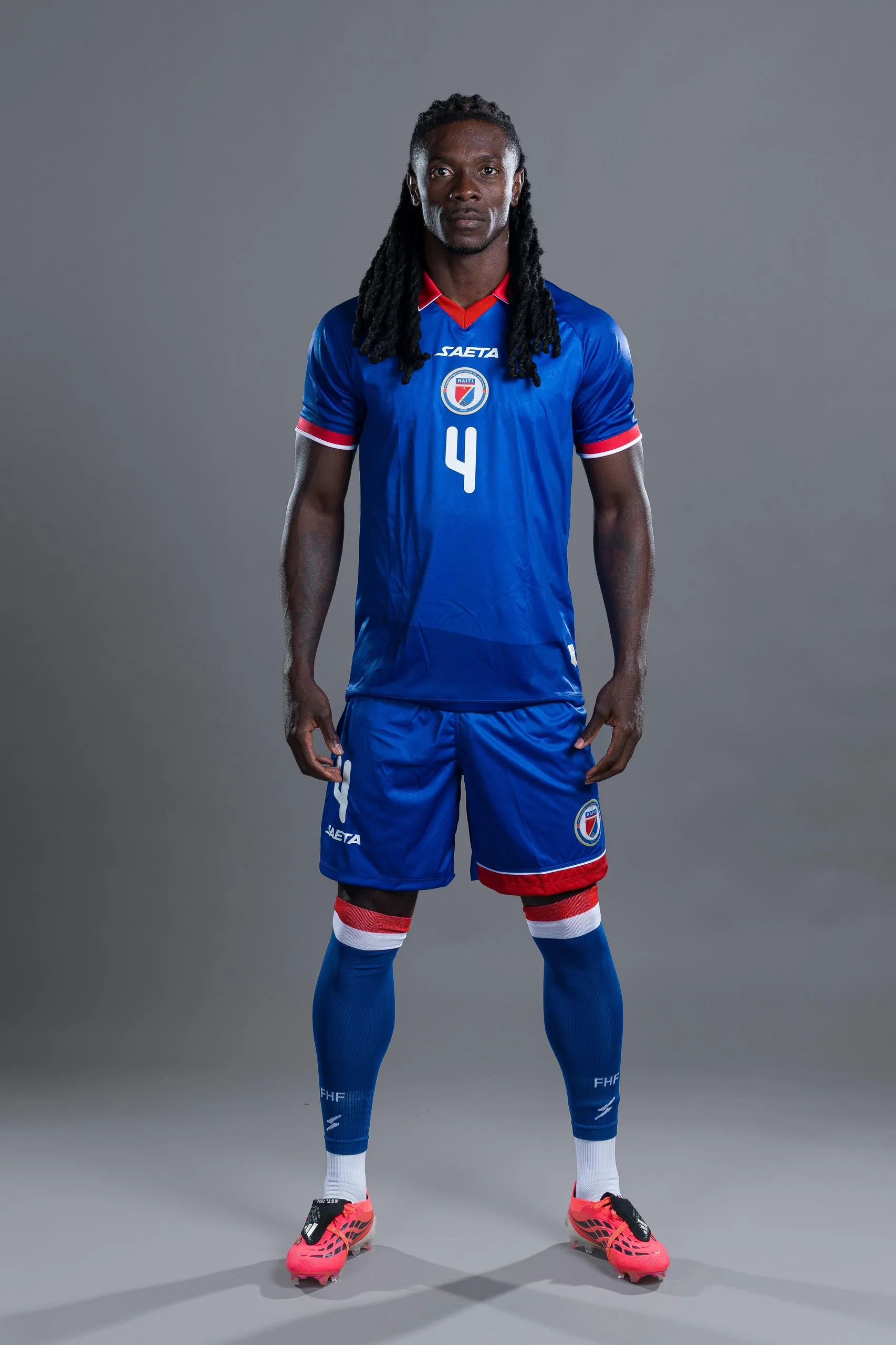 Haiti center-back Ricardo Adé poses in a Fifa portrait session wearing the altered jersey.
