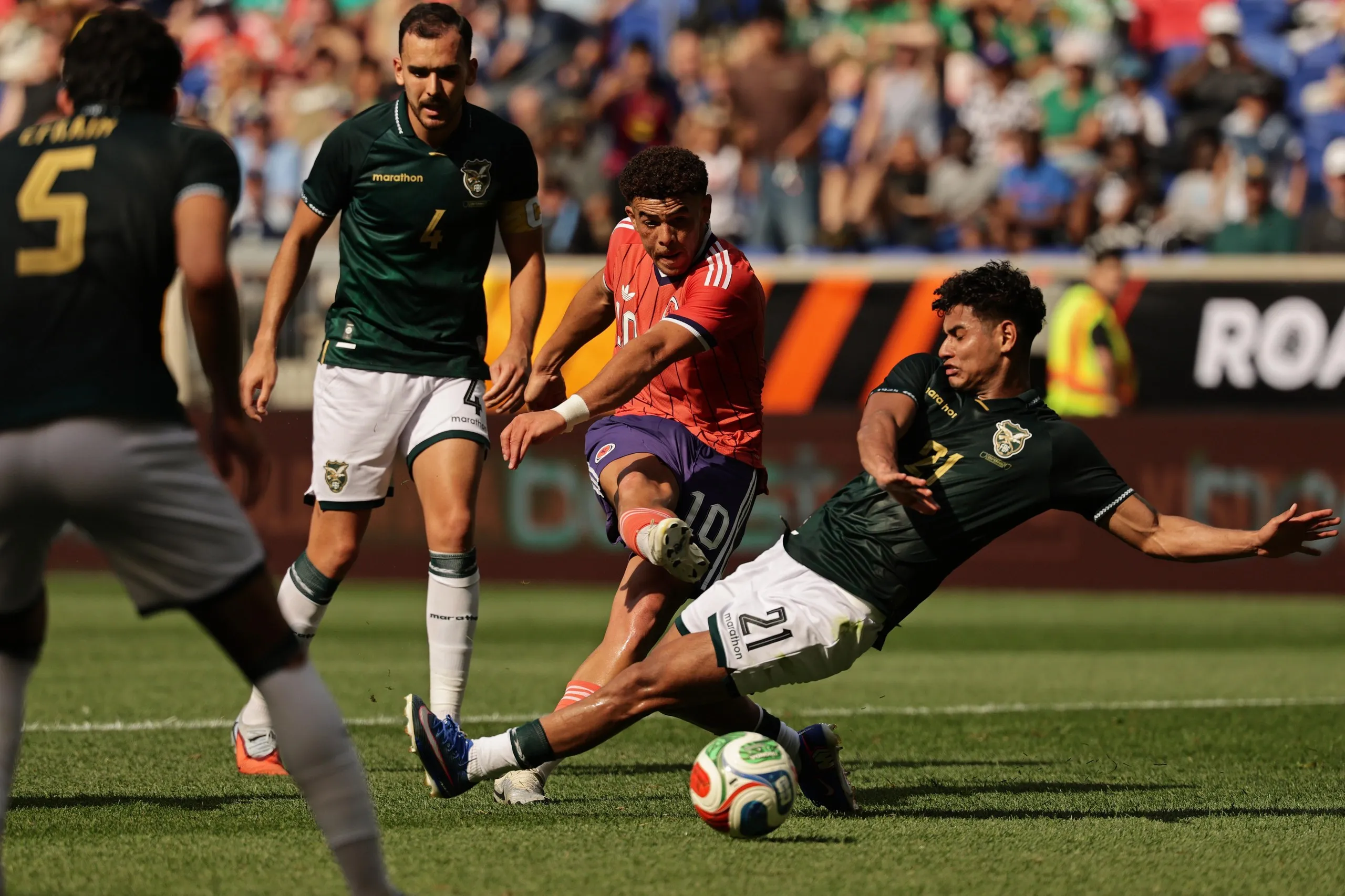 Scotland’s Ché Adams scores his second goal past Yomar Rocha of Bolivia in New Jersey